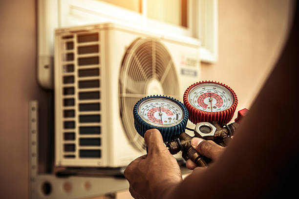 Professional Air Conditioning Service technician working in Fredericktown, OH